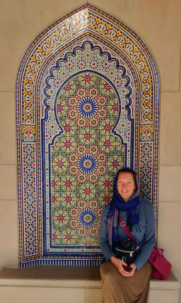 women in front of colourful mosaics, Sultan Qaboos Grand Mosque, Muscat Oman