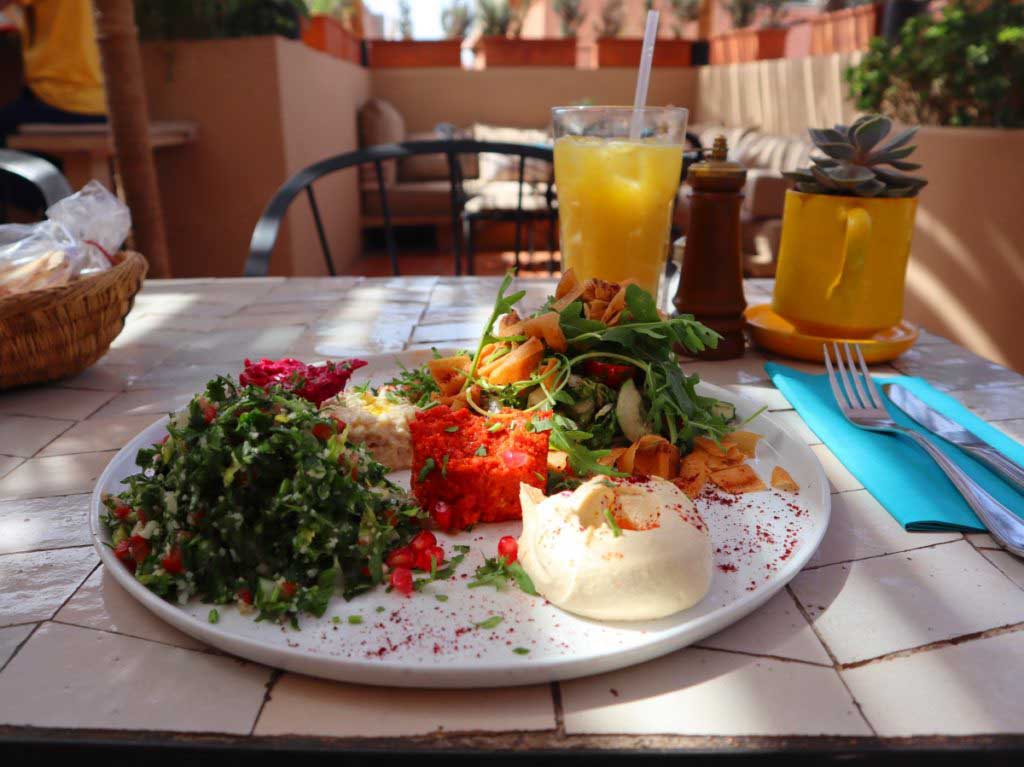 Tabouleh, Hummus and salad, orange drink