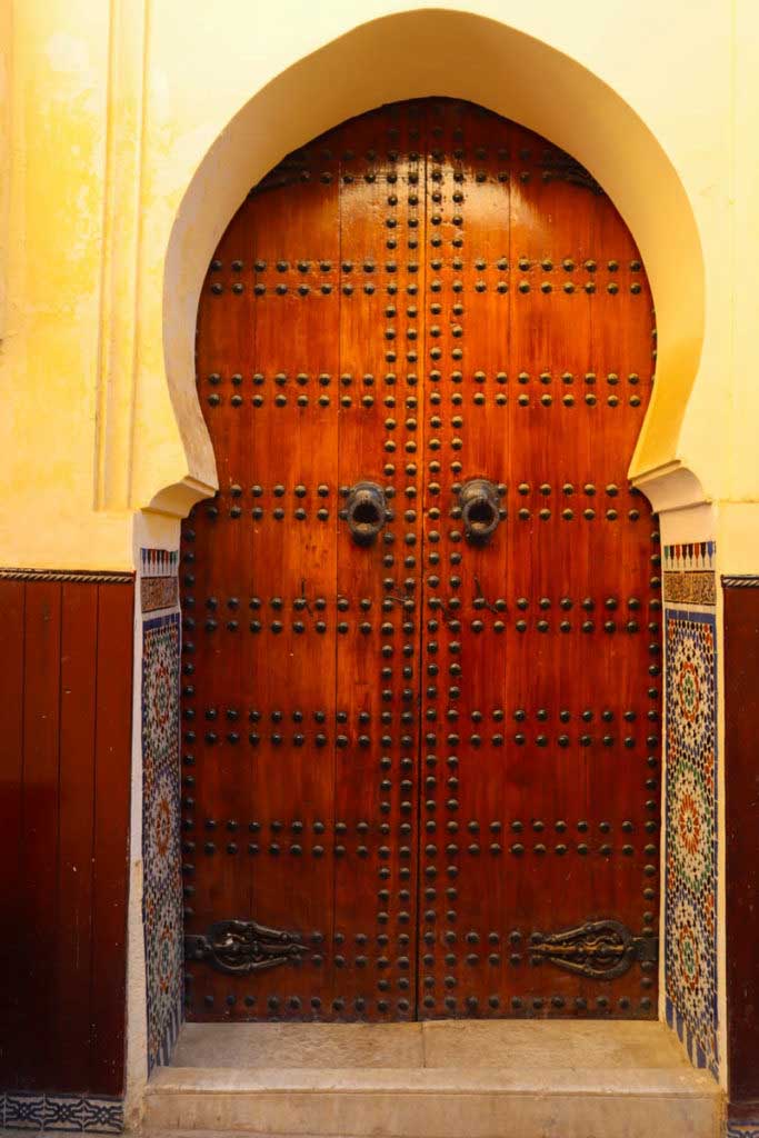 Beautiful dark wooden door in the medina in Meknes